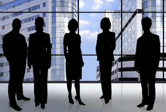 business people in front of an office window